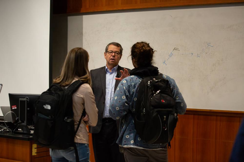 Professor Steve Buchwald talks with students at the Arnold C. Ott Lectureship
